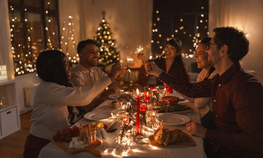 people celebrating the holidays around a dining room table