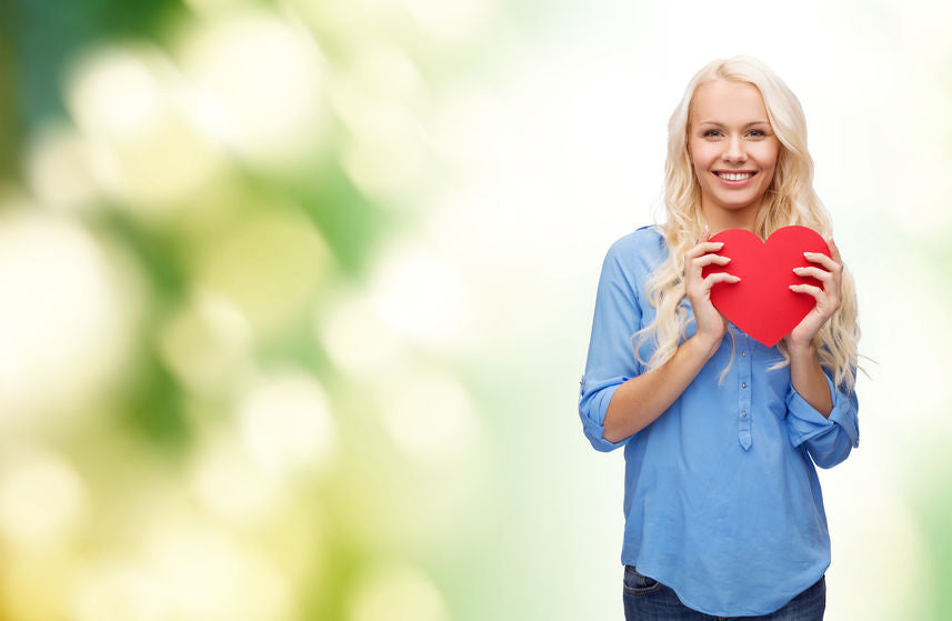 woman holding a red heart