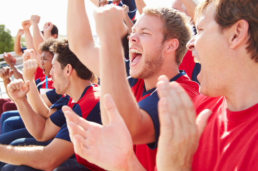 young men cheering at a sports event