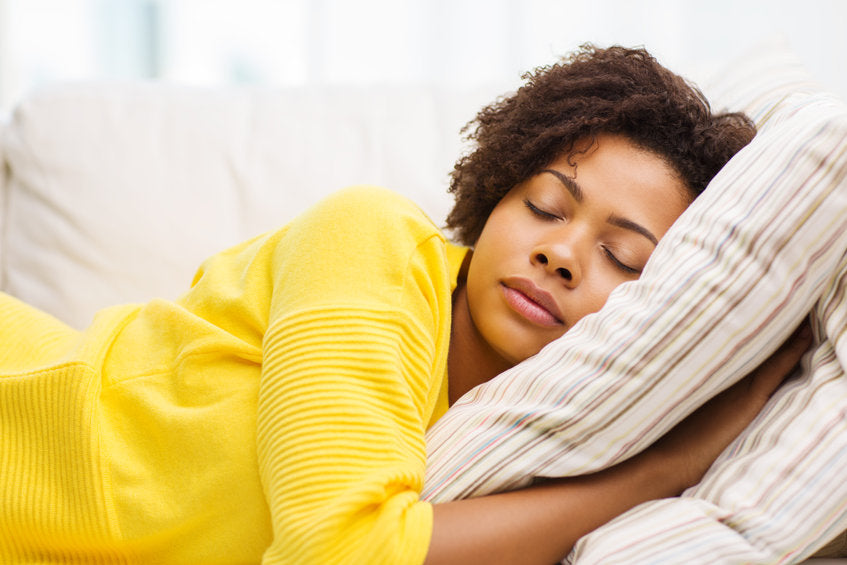 woman sleeping on sofa
