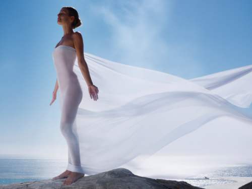 woman dressed in white outside in the sun