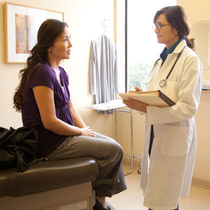 Female doctor talking with female patient