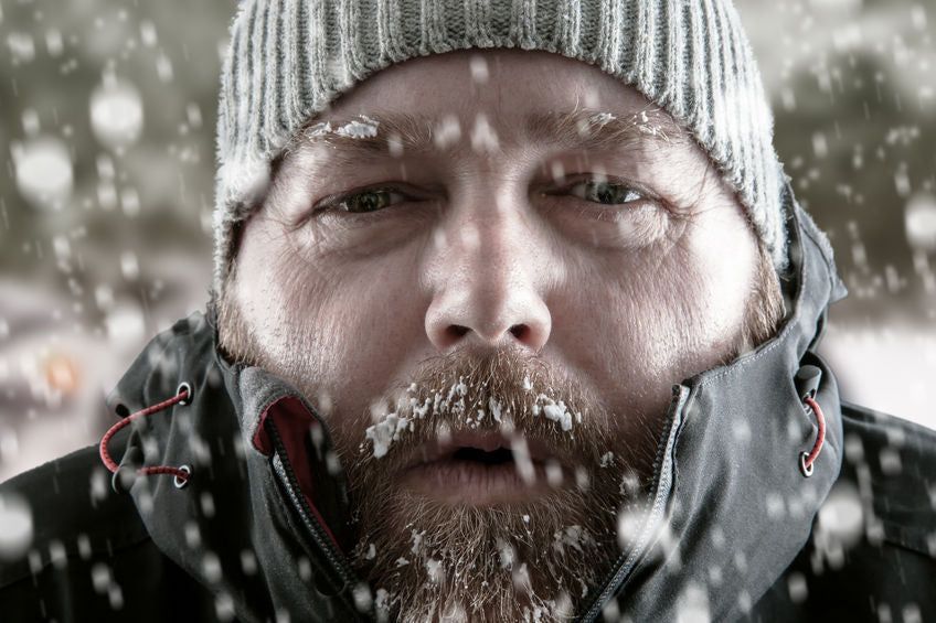 very cold man outside in the snow