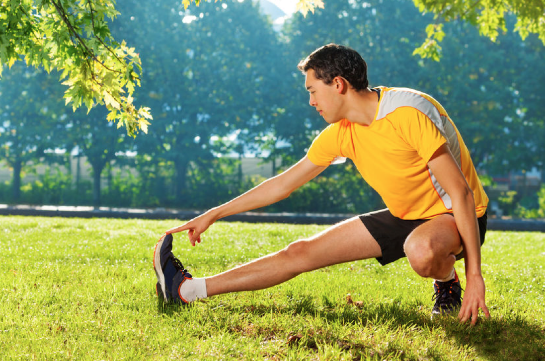 young man stretching before exercising