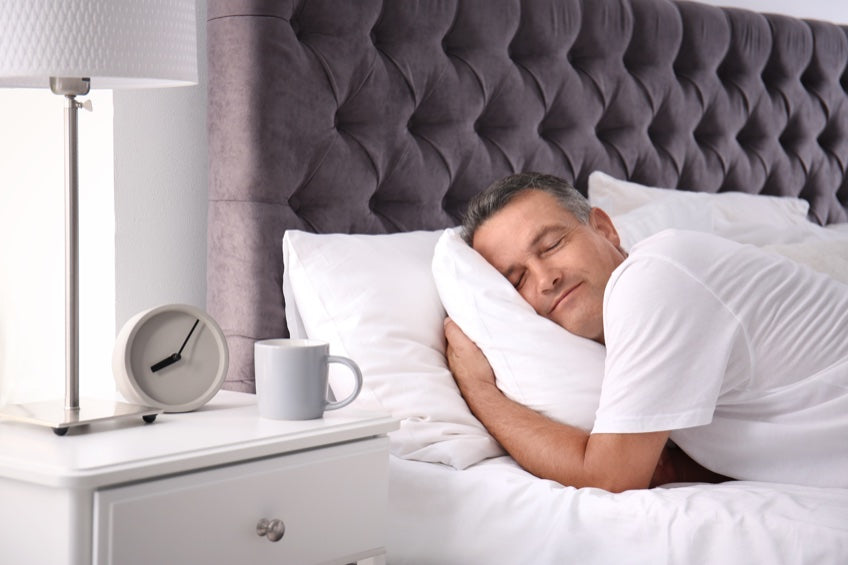 man sleeping in bed