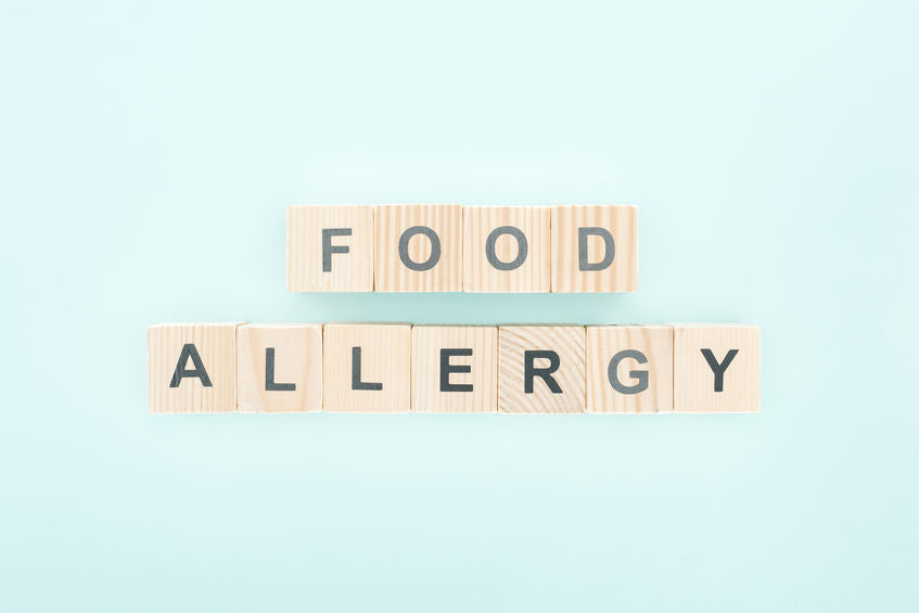 alphabet blocks spelling out food allergy