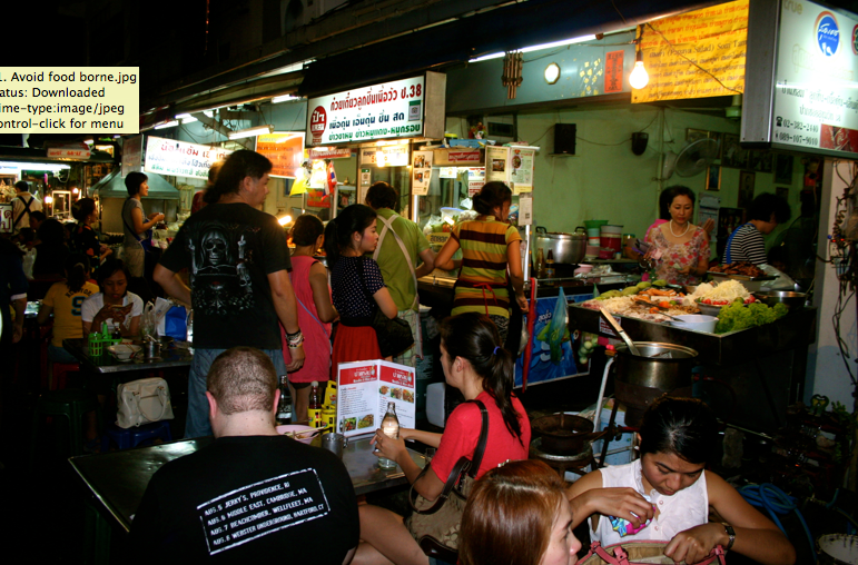 people outside at food stands