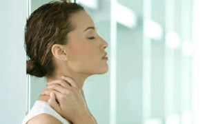young woman massaging her neck