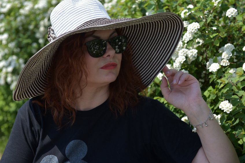 woman wearing large brimmed hat